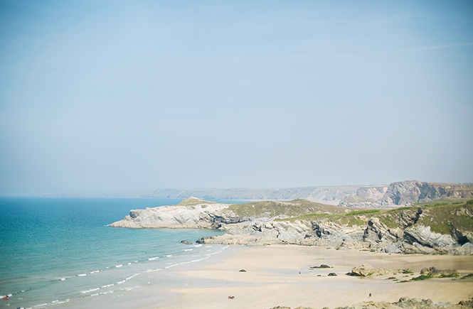 The beautiful Lusty Glaze beach with rugged rocks and clear blue seas