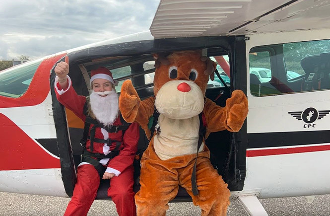 People dressed as Santa and Rudolph about to go skydiving to raise money for Cornwall Hospice Care