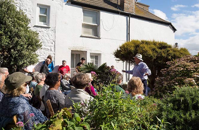 A group of people watching a spoken word performance at the St Ives September Festival