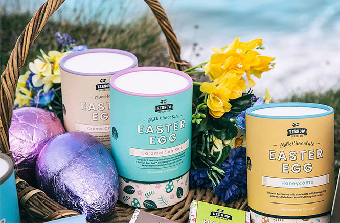 A selection of Easter eggs by Kernow Chocolate in a hamper on the cliffs of Cornwall