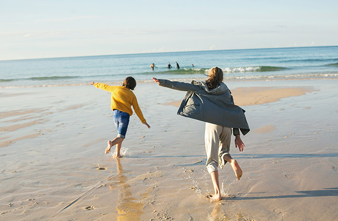 Kids playing in the sand on the beach, one of the best days out in Cornwall