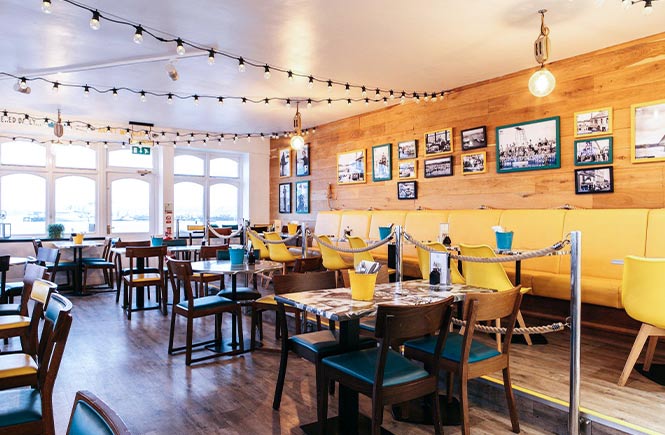 The bright and airy dog-friendly restaurant overlooking the water at Harbour Lights in Falmouth