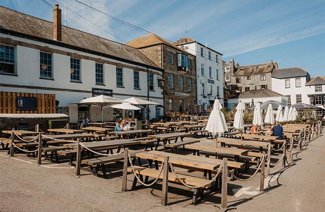 The sun-soaked outdoor seating area at The Stable in Falmouth