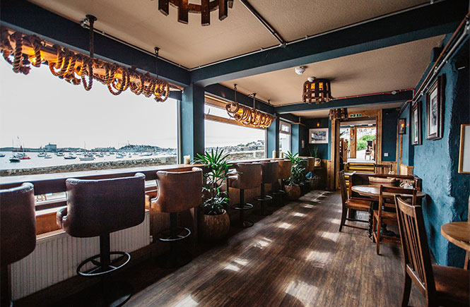 The sleek covered terrace overlooking Falmouth harbour at The Working Boat