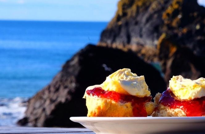 Scones with jam and clotted cream overlooking the cliffs and sea at Kynance Cove Cafe