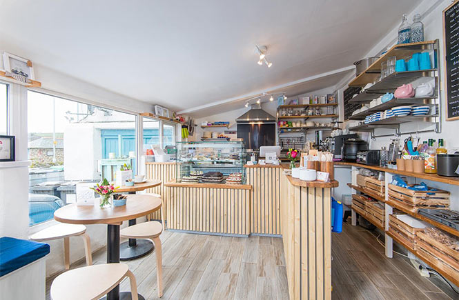 The bright and airy Little Bay Café where you'll find one of the best breakfasts in Cornwall 