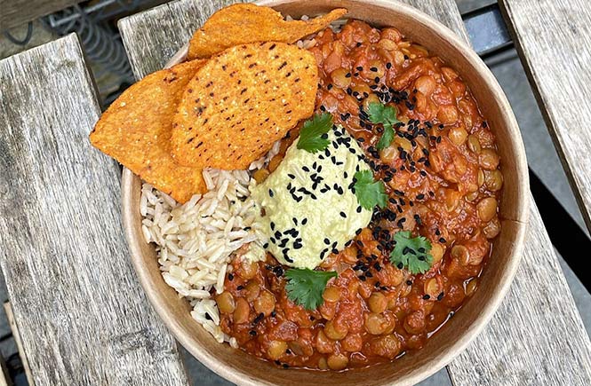 A bowl of vegan chili and tortillas from Sprout at The Yard