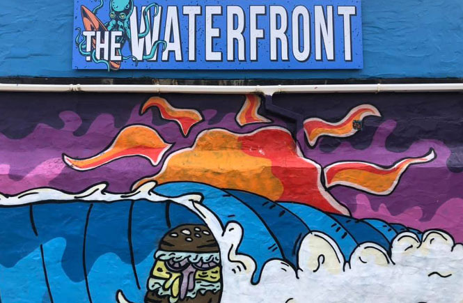 The awesome graffiti art on the wall outside The Waterfront in Perranporth