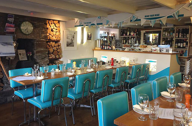 Colour blue chairs and a relaxed atmosphere at Seadrift in Porthleven