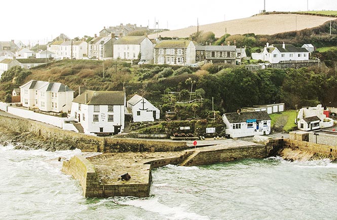 Looking out over Porthleven's harbour towards The Ship Inn with its terraced beer garden
