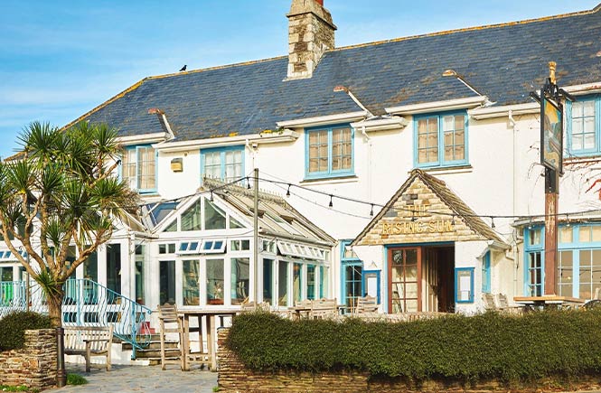 The pretty and traditional exterior of The Rising Sun in St Mawes