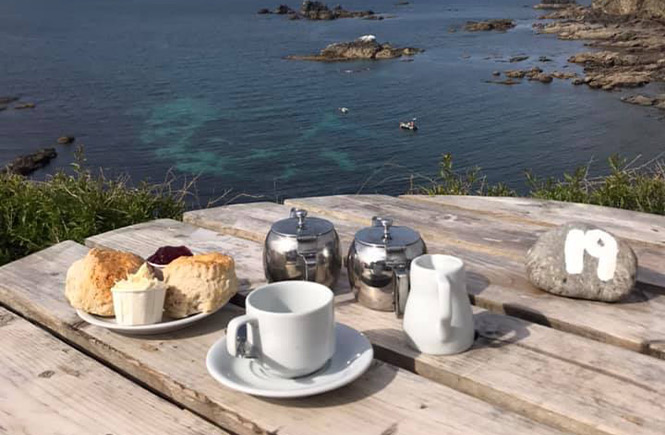A cornish cream tea overlooking the incredible cliffs and sea at the Lizard Point from Polpeor Café