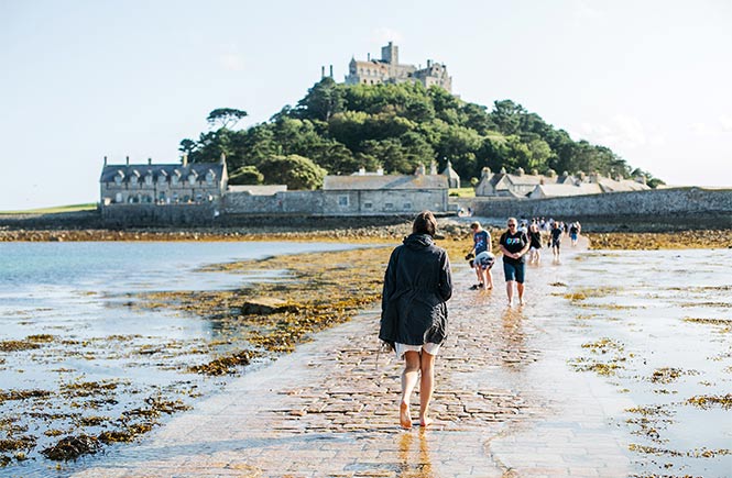 People walking along the causeway to St Michael's Mount in Marazion