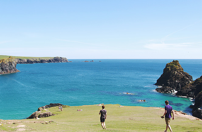 People walking along the cliffs above Kynance Cove in South Cornwall