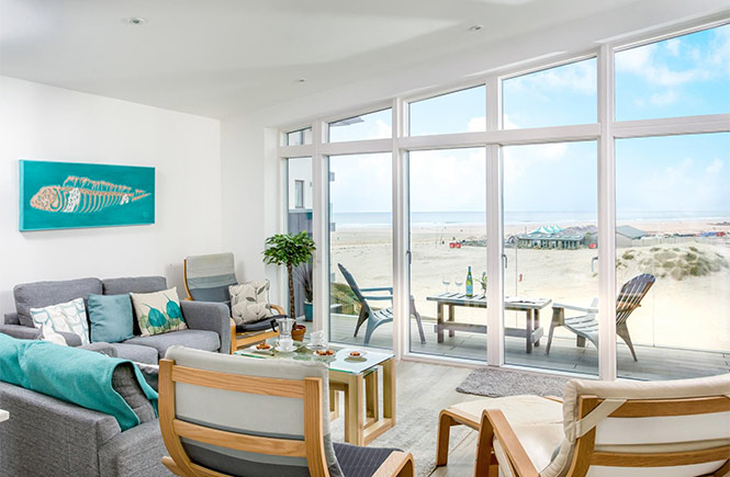 Looking out of the huge windows in the living room at Cloud Nine at Perranporth beach