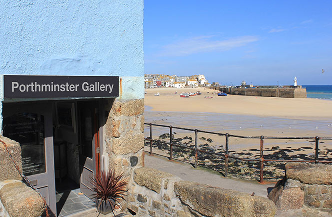 The quaint entrance to Porthminster Gallery with the beach and St Ives in the background