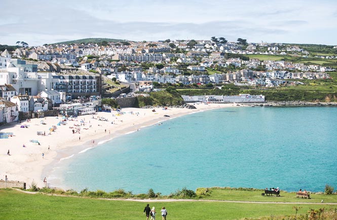 Looking across Porthmeor beach at the impressive Tate St Ives in Cornwall