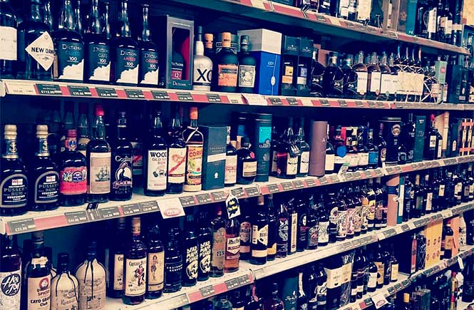 Shelves upon shelves of rum at Constantine Stores