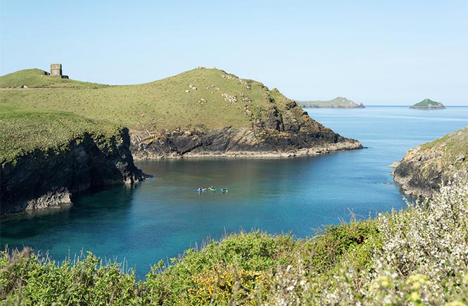 People kayaking in the inlets around Port Isaac