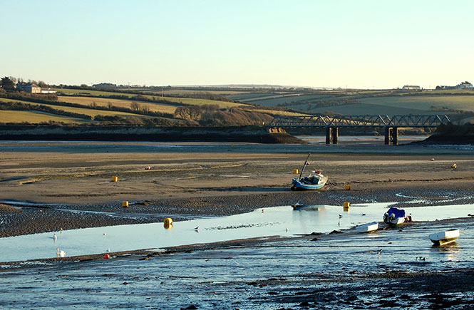 Looking up the Camel Estuary at an iron bridge and sweeping countryside