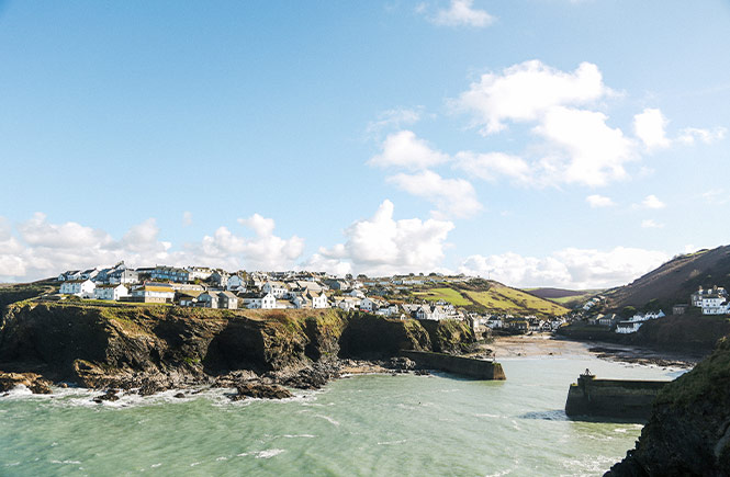 The sprawling coastal village of Port Isaac perched atop the cliffs