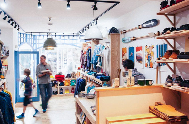 The interior of Common Wanderer, where outdoor clothing and accessories line the shelves