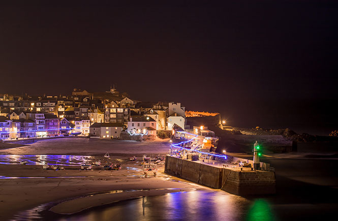 St Ives harbour lit up by Christmas lights