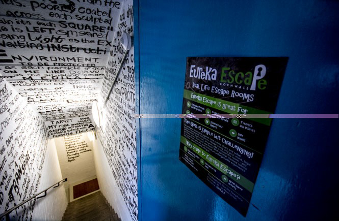 Stairs leading down to Eureka Escape with writing all over the walls