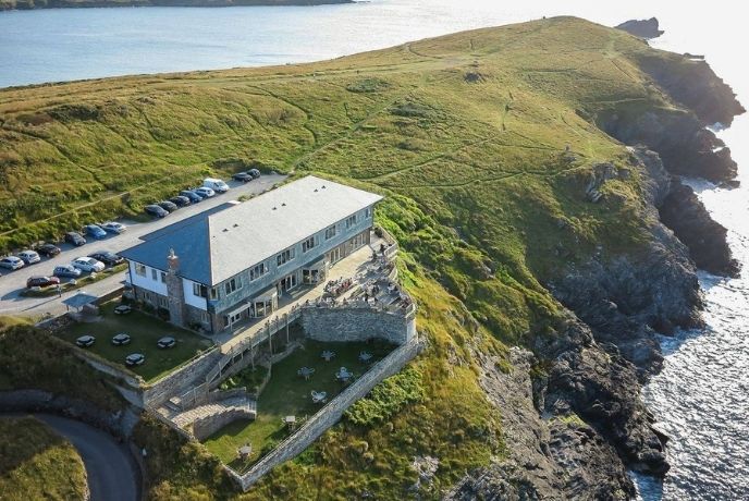 A birds eye view of Lewinnick Lodge with the headland and sea