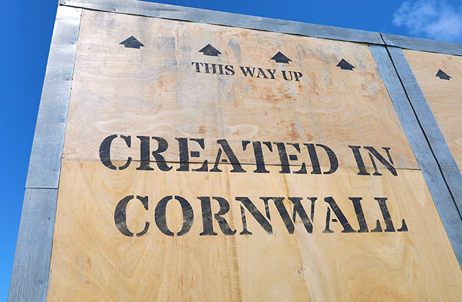 A huge wooden box with the words created in Cornwall printed on it