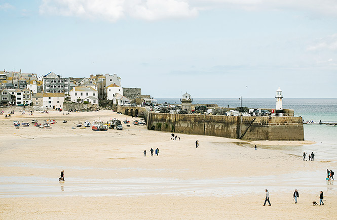 Looking out across Harbour beach at the shops and cafes of St Ives