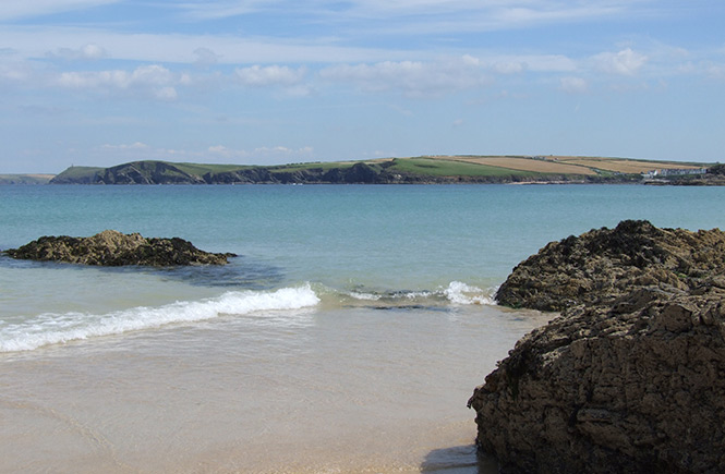 The blue waters and rock formations at Harlyn Bay