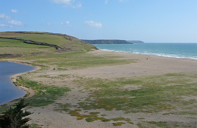 Looking down the stretch of sand at Loe Bar beach near Porthleven