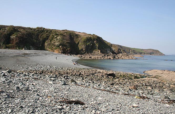 The shingly beach at Porthallow, one of the best dog-friendly beaches in Cornwall