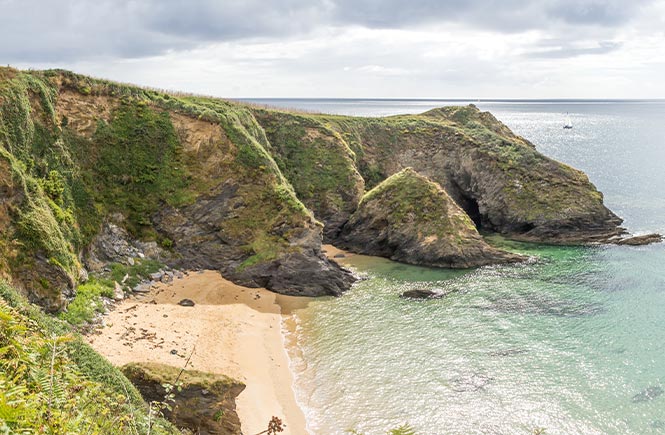 The sandy cove at Porthbeor beach near St Mawes