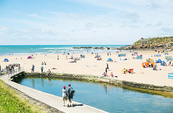 People enjoying the lovely Bude Sea Pool at Summerleaze Beach in Bude