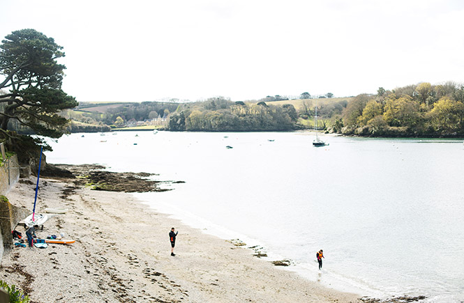 People enjoying the sand and sea at Summers beach in St Mawes