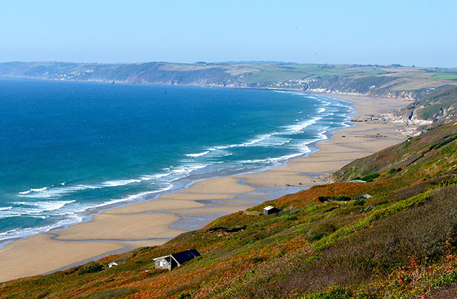 Looking out over the huge expanse of sand and sea at Whitsand Bay