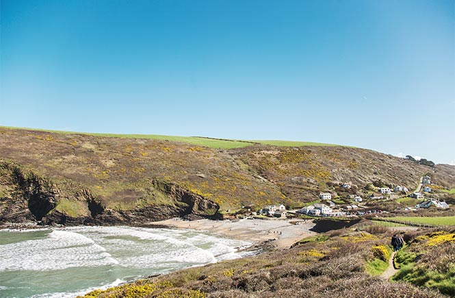 Looking over the cliffs at the small, sandy beach at Crackington Haven in Bude