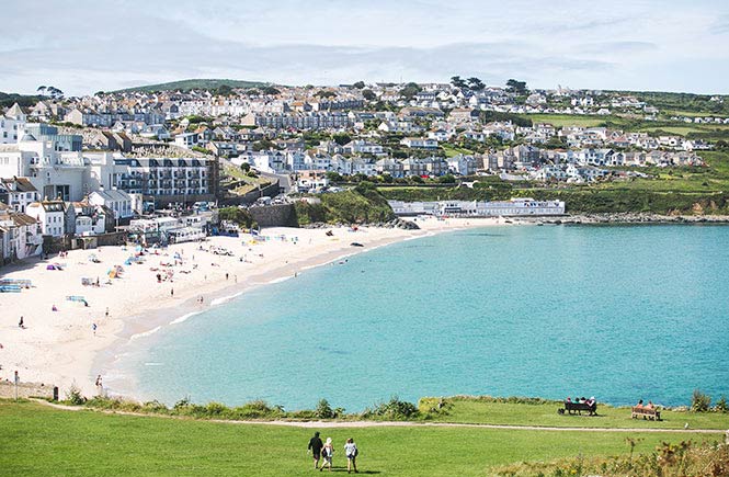 The white sands of Porthmeor beach with St Ives behind