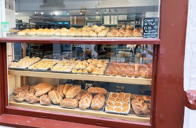 The shop window at Quay Bakery in Cornwall full of freshly baked breads and pastries