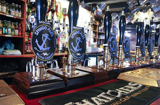 A line of Spingo ale taps at The Blue Anchor in Cornwall