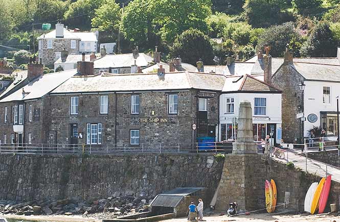 Looking across the beach at The Ship Inn in Mousehole
