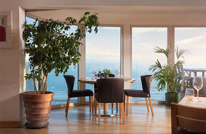 The dining room with sea views at Lewinnick Lodge in Newquay