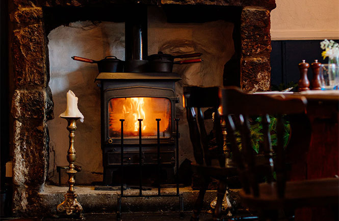 The cosy fireplace at Victoria Inn in Cornwall