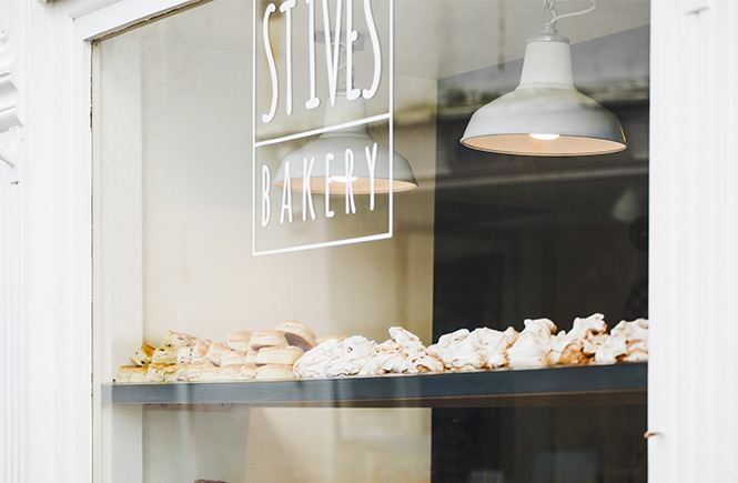 The window of St Ives Bakery in Cornwall full of pastries and meringues 