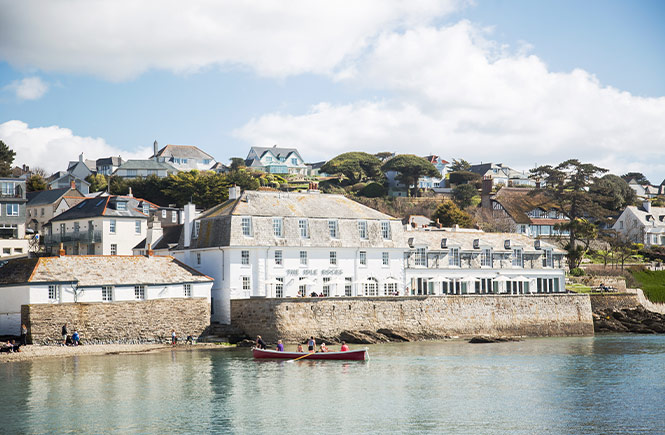 The beautiful white exterior of Michelin recommended The Idle Rocks on the harbourfront in St Mawes