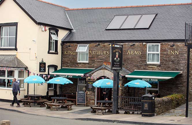 The King Arthur's Arms Inn with outdoor seating outside