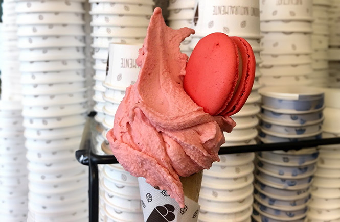 A strawberry gelato ice cream with a macaroon on top from Aneglato Truro in Cornwall 
