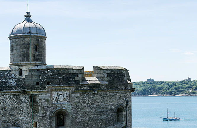 The circular exterior of St Mawes Castle with the sea in the background